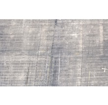 Gros plan d''une surface en béton avec des fissures et des traces d''usure