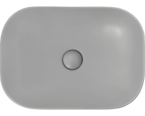 Vue de dessus d''un lavabo à poser rectangulaire en céramique avec garniture de vidange