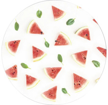 Motif circulaire avec des tranches de pastèque et des feuilles