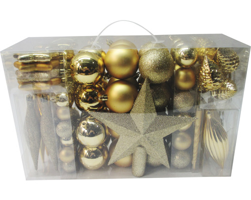 Assortiment de boules de Noël dorées et étoile de Noël dans un emballage transparent