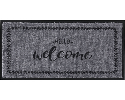 Fußmatte mit der Aufschrift ''Hello welcome'' und Blattmuster.