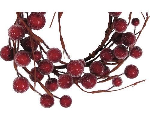 Couronne décorative avec des baies rouges pour décorations festives