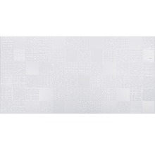 Carreau mural blanc avec un motif de surface structuré.