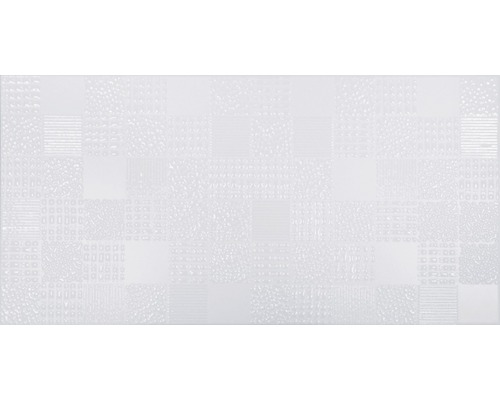 Carreau mural blanc avec un motif de surface structuré.