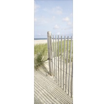 Scène avec une clôture en bois sur la plage