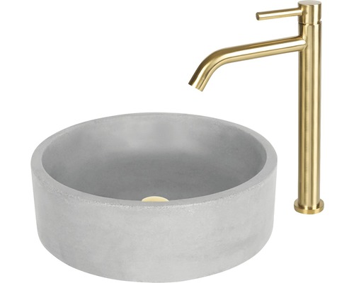 Rundes Aufsatzwaschbecken aus Beton mit goldener Armatur