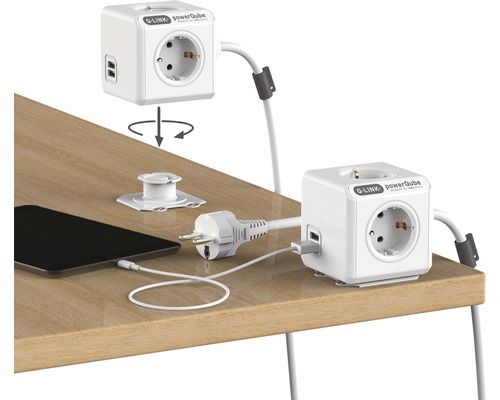 Q-Link Powercube multiprise avec ports USB sur une table avec tablette et prise secteur