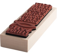 Stempel mit christlichem Motiv auf Holzsockel