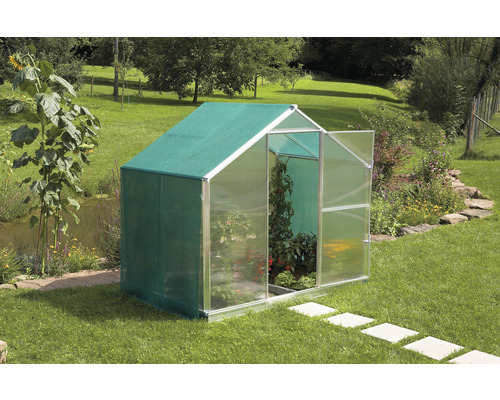 Bâche d'ombrage Gutta avec œillets 8,70 m² 580 x 150 cm vert Serre de jardin avec porte ouverte et plantes à l''intérieur.