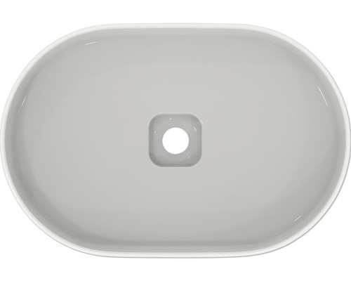 Vue de dessus d''un lavabo ovale en céramique avec une bonde carrée