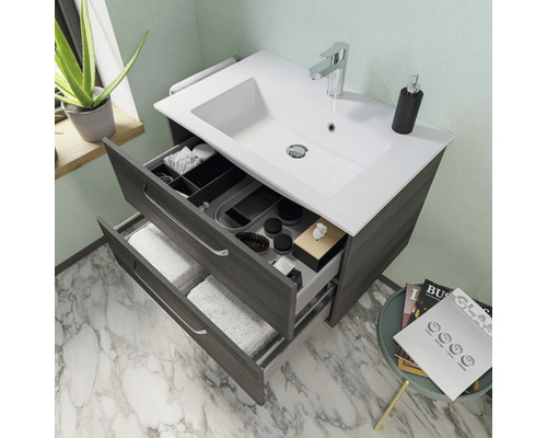 Meuble sous-lavabo avec deux tiroirs ouverts dans la salle de bain