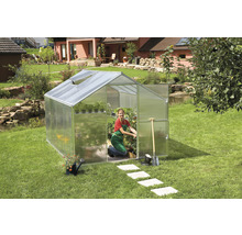 Serre de jardin avec jardinière et outils de jardinage