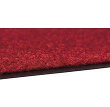 Gros plan d''un tapis rouge avec un dessous noir