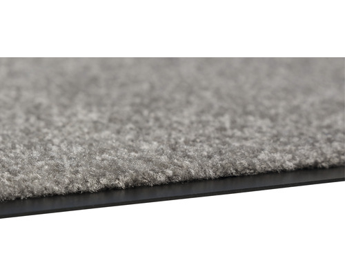 Tapis gris avec dessous noir