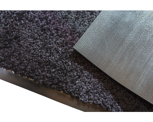 Gros plan d''un paillasson avec surface textile et envers structuré