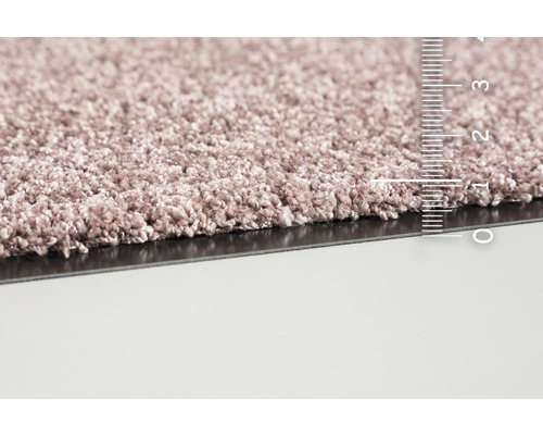 Gros plan d''un tapis avec une échelle de mesure pour déterminer la hauteur des fibres