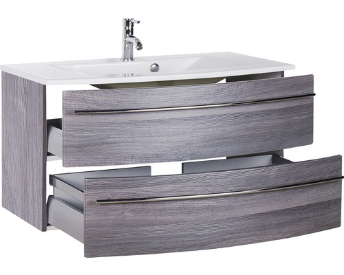 Meuble sous-lavabo avec deux tiroirs ouverts, vasque à poser et robinet