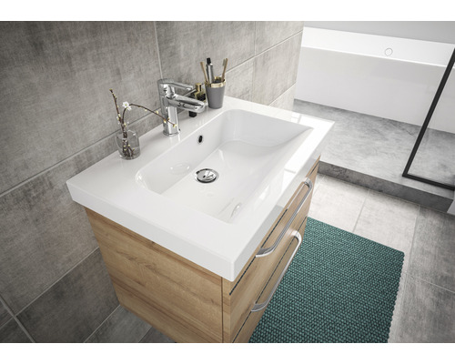 Meuble de salle de bains avec lavabo blanc et structure en bois