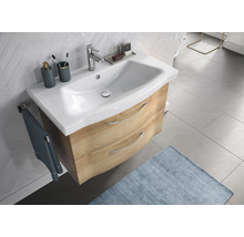 Waschtisch mit Unterschrank, zwei Schubladen und Armatur im Badezimmer.
