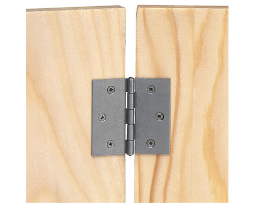 Charnière de porte en métal fixée sur une porte en bois