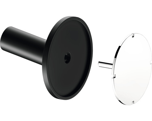 Detailansicht eines schwarzen Badezimmeraccessoires mit einer runden, silberfarbenen Abdeckung