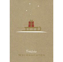 Carte de Noël avec un cadeau sur un traîneau et le texte ''Joyeux Noël''