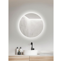 Salle de bains avec miroir rond, lavabo et robinetterie