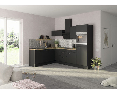 Moderne Küche mit schwarzen Schränken, hellem Holzarbeitsplatten und Fliesenspiegel