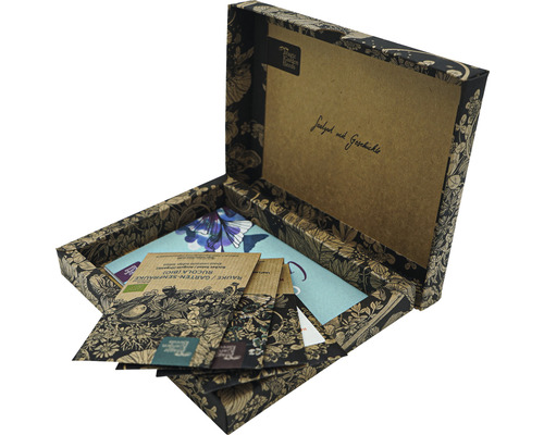 Boîte de semences ouverte avec différents sachets de graines