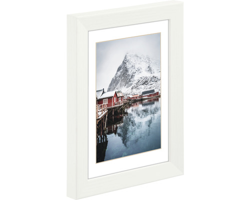 Bilderrahmen mit Fotografie von einem Bergdorf im Winter