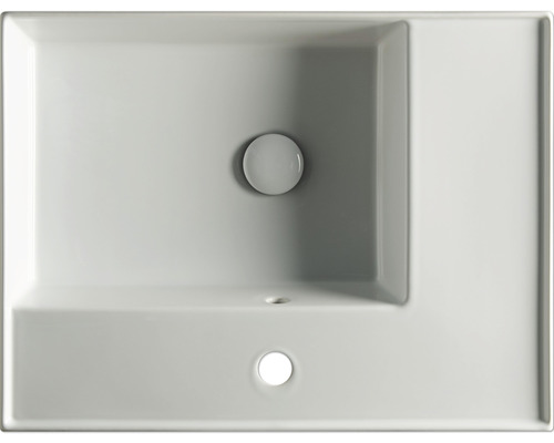 Vue de dessus d''un lavabo en céramique sanitaire avec plage de robinetterie