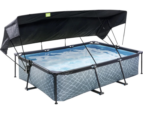 Piscine rectangulaire avec voile d''ombrage pour le jardin.