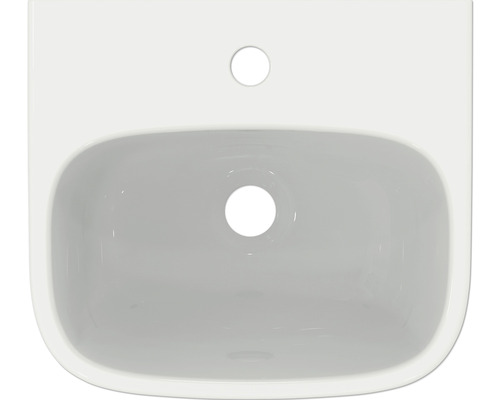 Photo d''un lavabo blanc avec trou de robinet et trop-plein