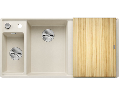 Évier de cuisine beige avec égouttoir et planche à découper en bois