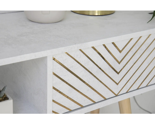 Gros plan d''une table blanche avec tiroir et motif zigzag doré
