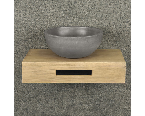Lavabo en béton sur une étagère en bois