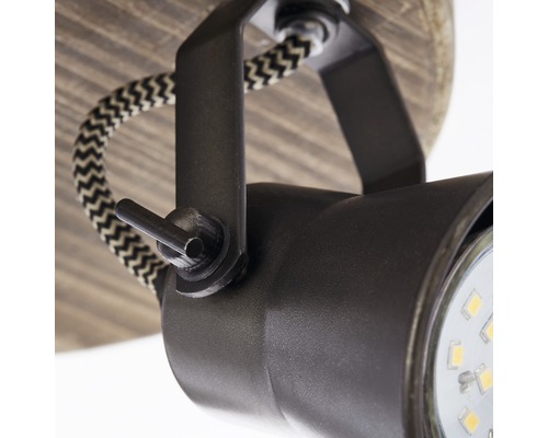 Gros plan d''un plafonnier avec spot réglable et câble textile