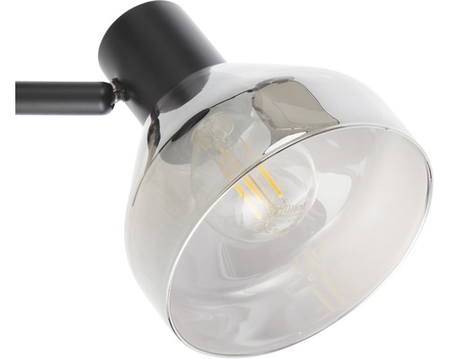 Detailaufnahme einer Lampe mit Lampenschirm aus Glas