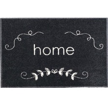 Fußmatte mit dem Schriftzug Zuhause und dekorativen Elementen