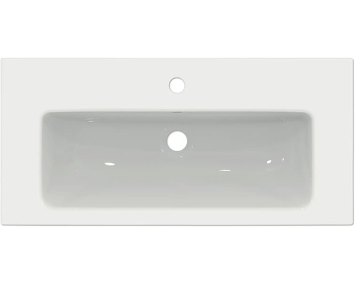 Vue de dessus d''un lavabo en céramique avec trou de robinet et trop-plein