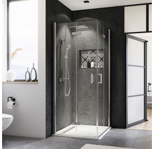 Salle de bains avec cabine de douche en verre et robinetterie