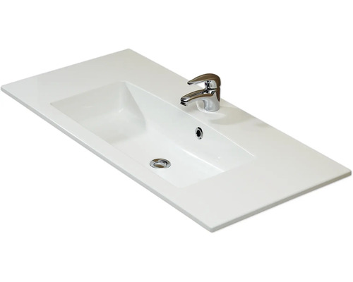 Lavabo en céramique avec robinet pour la salle de bain