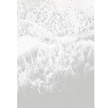 Vue aérienne de vagues déferlant sur une plage de sable