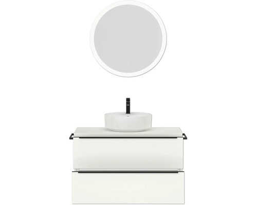 Badezimmer mit rundem Spiegel, Waschtisch und Waschbecken