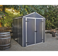 Abri de jardin métallique avec double porte dans un décor de jardin