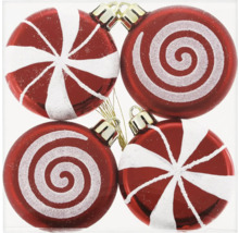 Vier rote Weihnachtskugeln mit weißen Mustern