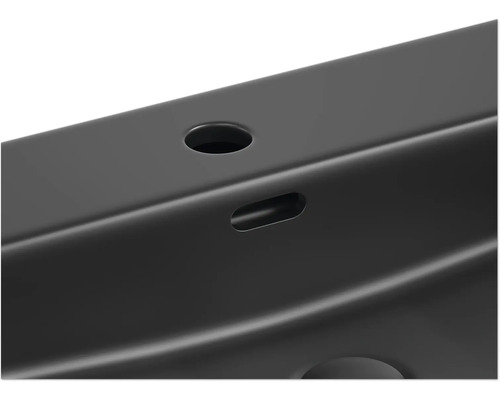 Vue détaillée d''un profilé métallique noir avec des trous et des évidements.