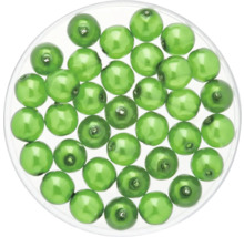 Grüne Schmuckperlen in transparenter Dose