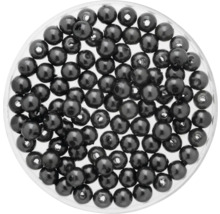 Perles noires décoratives dans un récipient