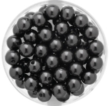 Perles décoratives noires dans une boîte transparente